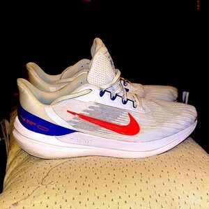 Nike running shoes. Size 11.5. White, neon orange, purple heel.